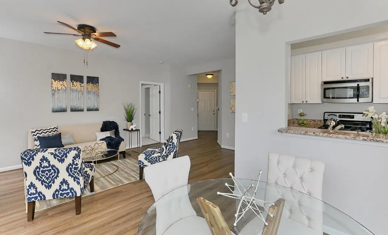 Bright sitting area with patterned accent chairs.