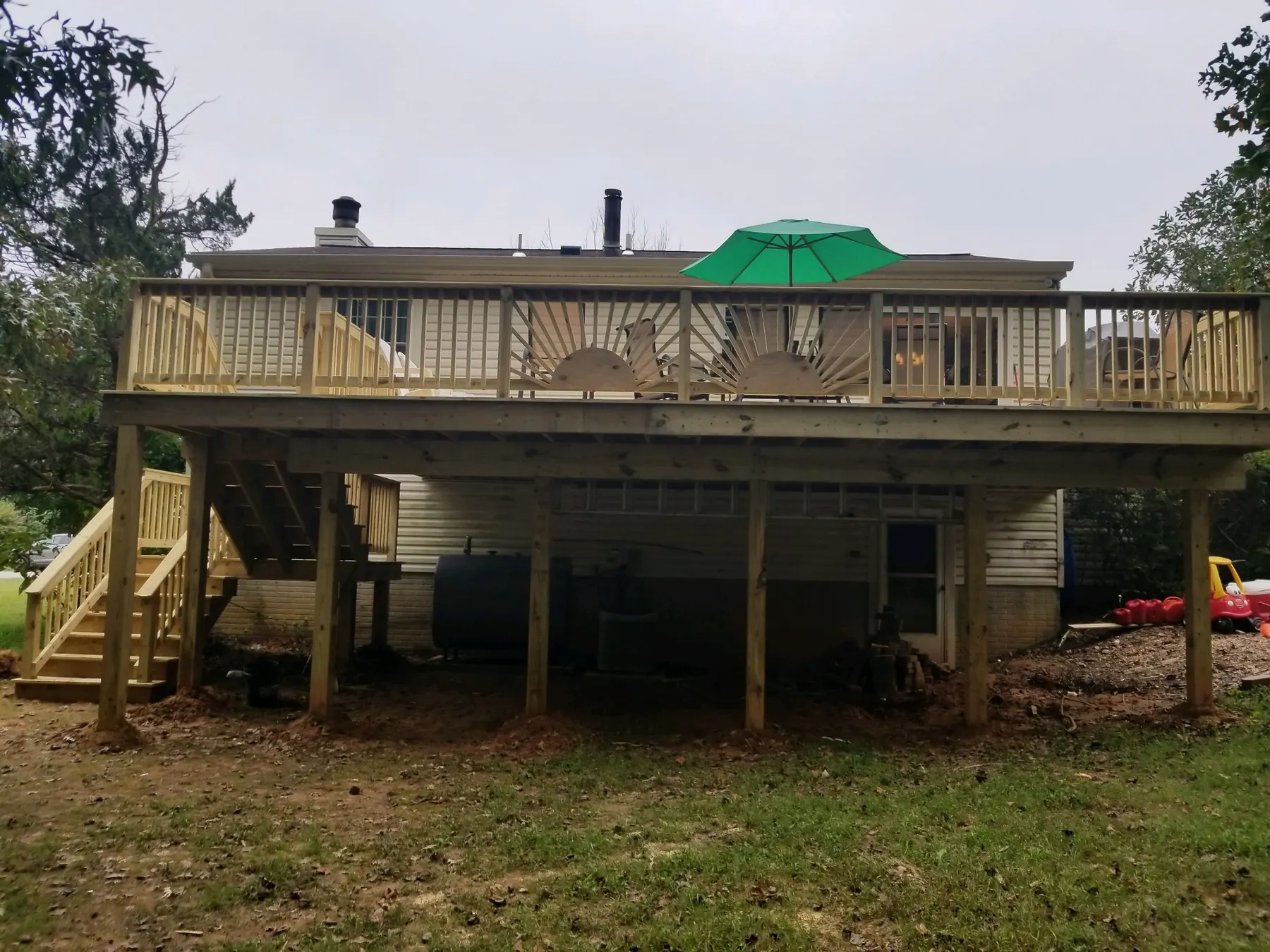 Full span of a new elevated pressure-treated deck.